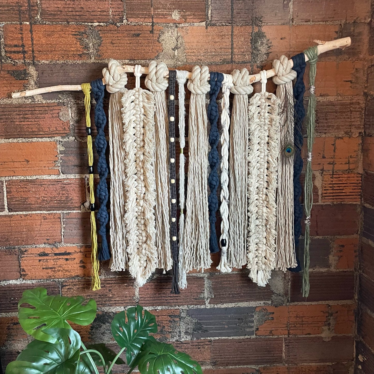 Feathery Fringe Mixed Macrame Wall Hanging On Brick Wall With Feathers Straight