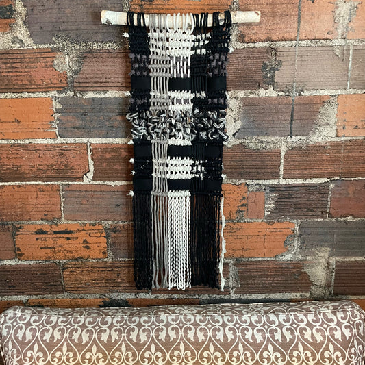 "Brambles" Macramé Wall Hanging on brick wall