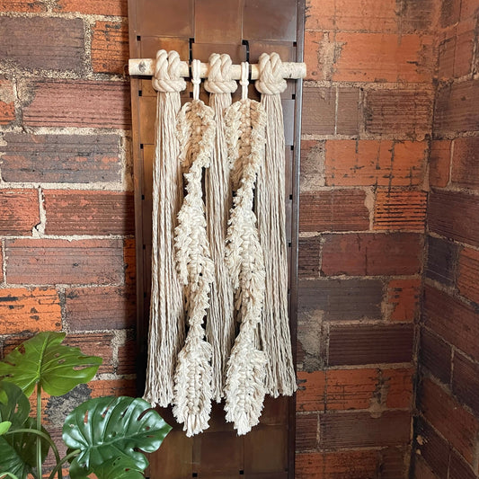 Feathery Fringe Duo Macrame Wall Hanging On Brick Wall